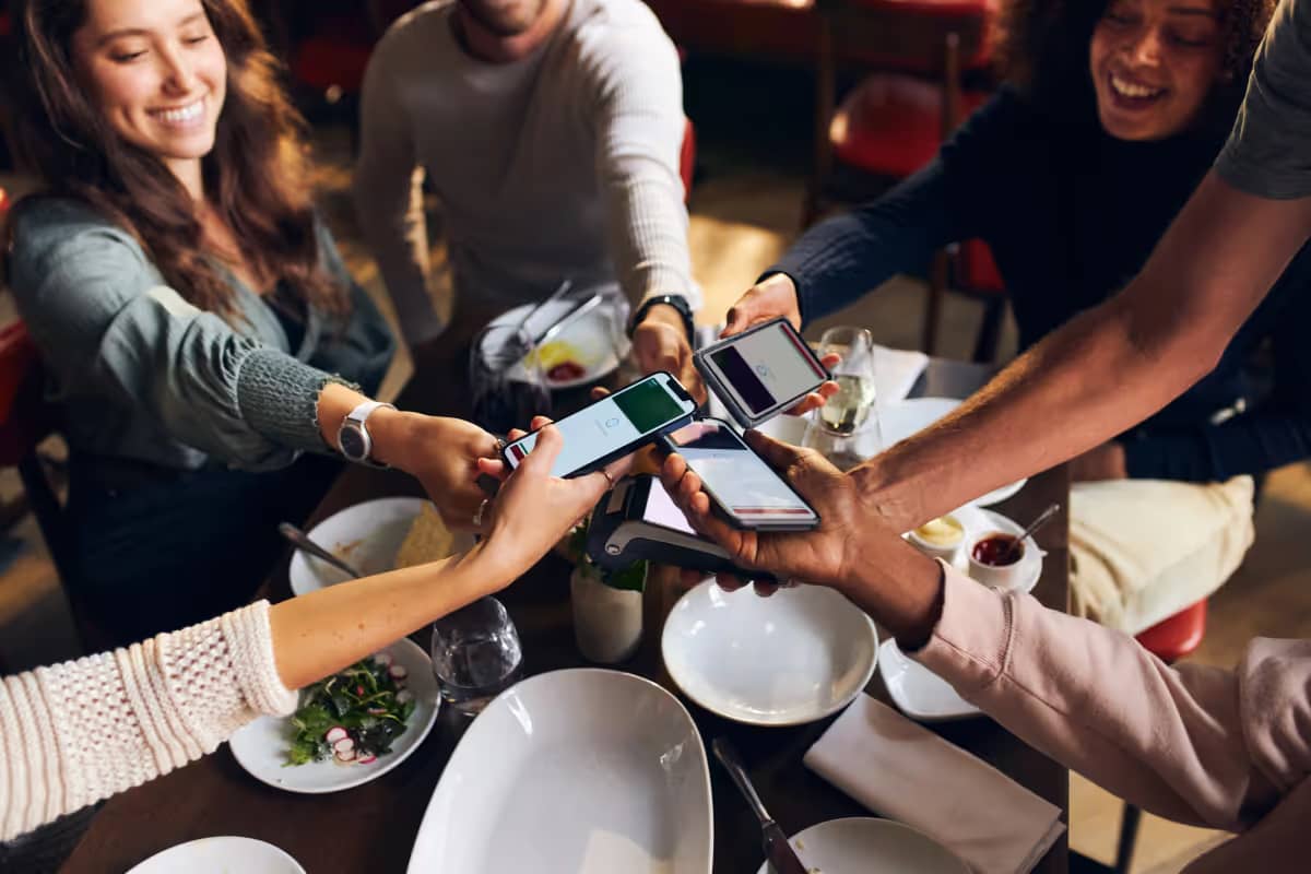 Friends sharing the bill at a restaurant