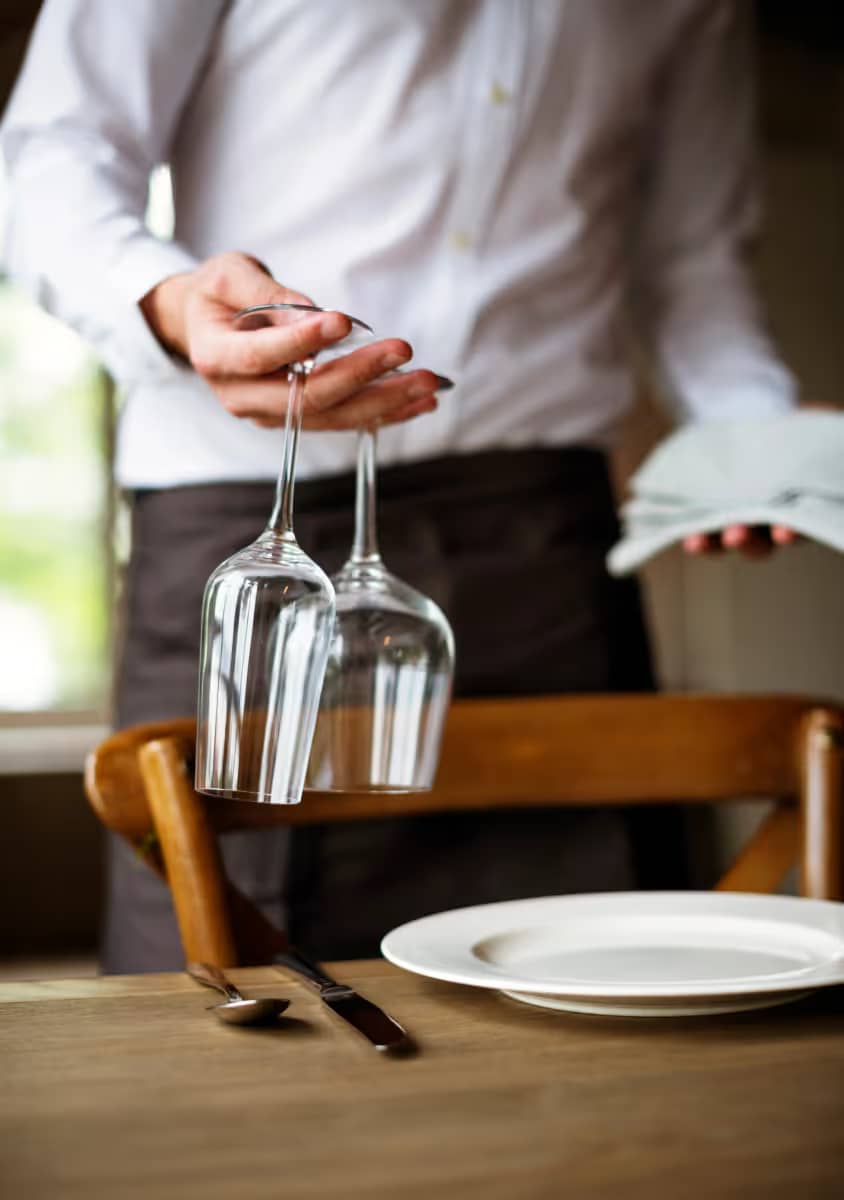 Service staff at the table and at the POS terminal