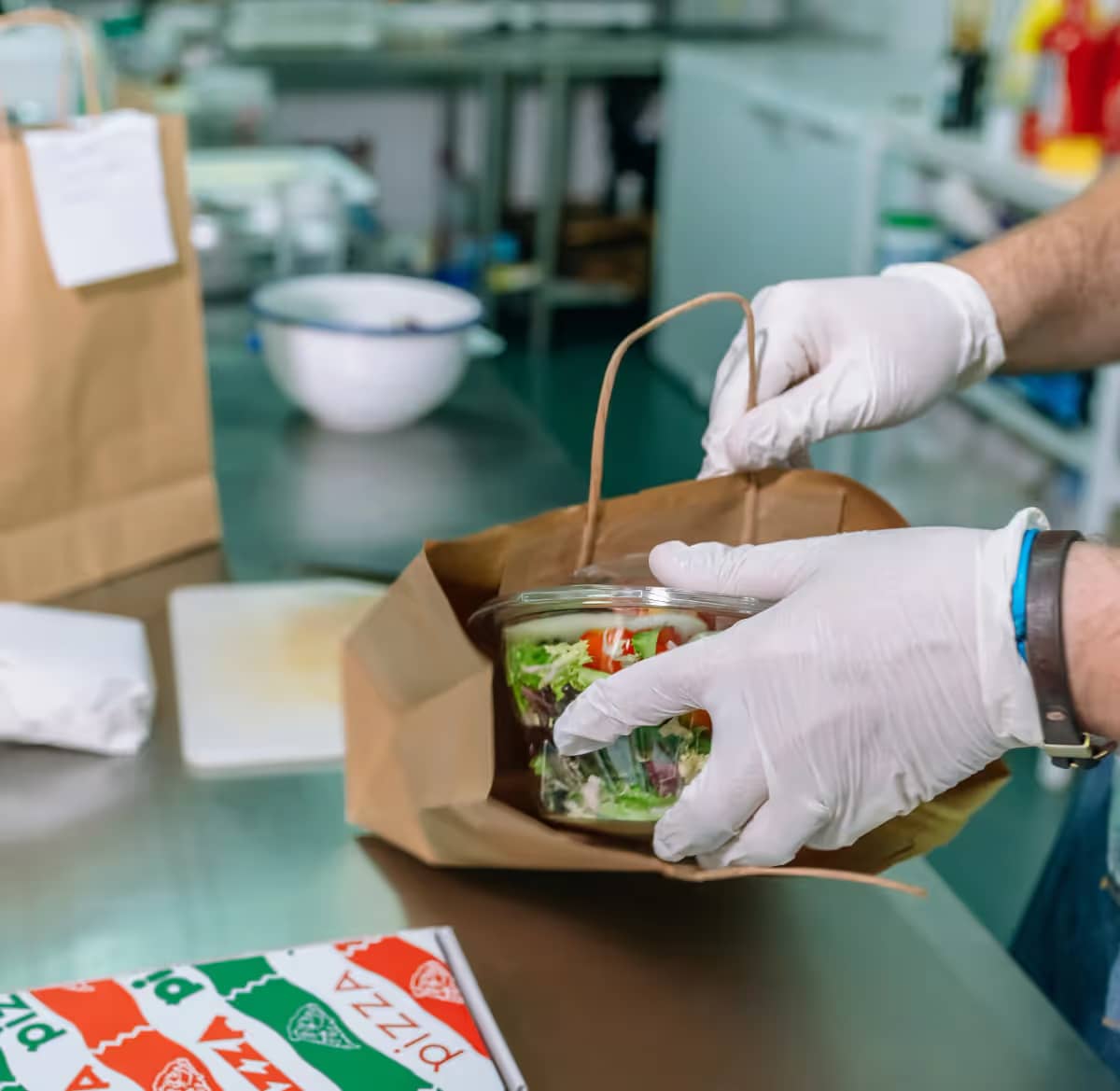 A laptop and an Iphone with a digital webshop to pre-order food online